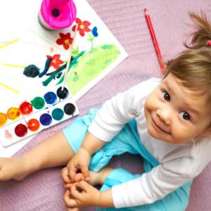 Child with watercolor paints