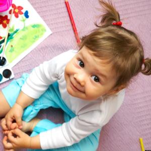 Child with watercolor paints